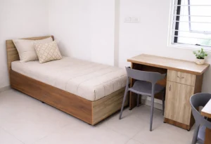 Cozy and comfortable shared hostel room with modern interiors at Serenity Hostels